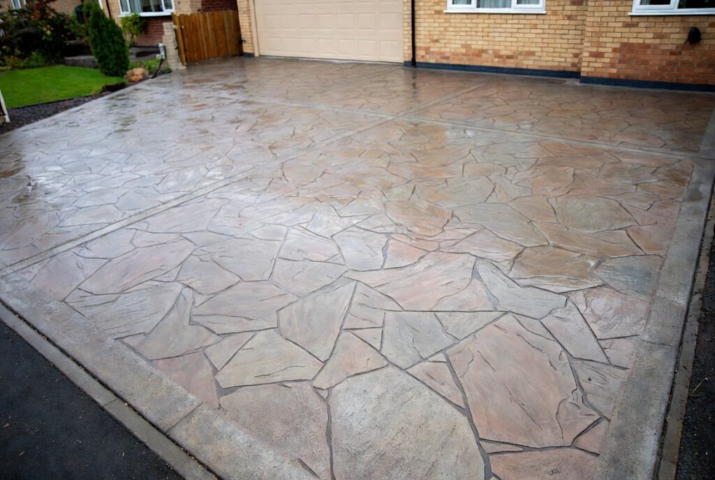Stamped concrete driveway Croydon featuring realistic slate and brick pattern by GSMS Construction